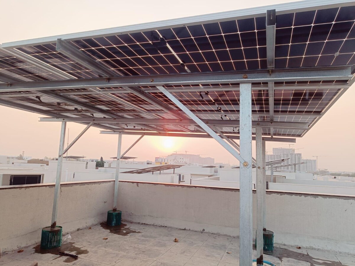 Solar installation at sunset by Kausthubha Power Systems